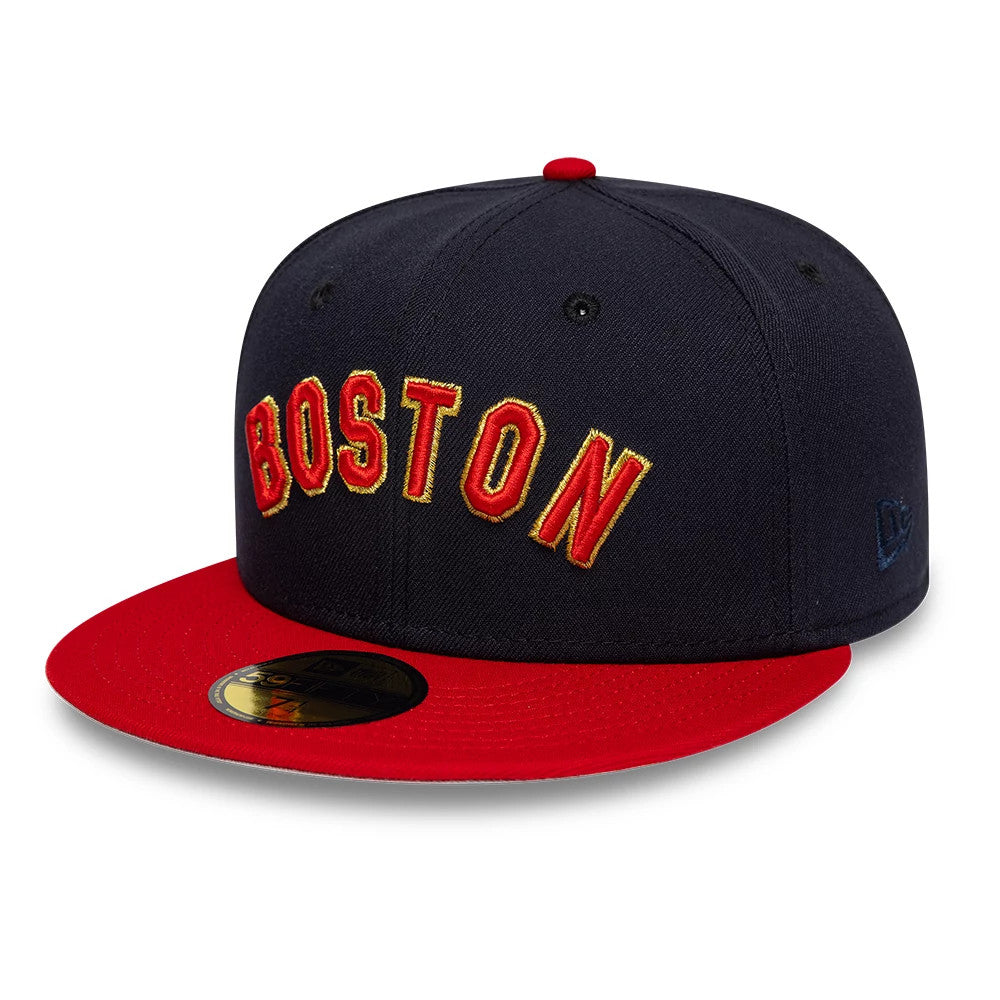 Boston Red Sox MLB Cooperstown Navy New Era 59FIFTY Fitted Cap, three-quarter view showing red BOSTON lettering with yellow outline embroidery on the front panel, complemented by a red visor and top button.