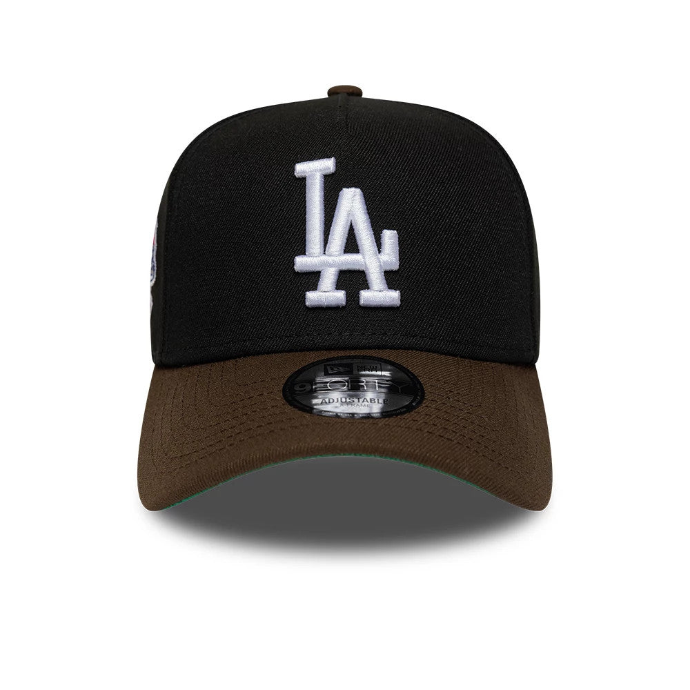 LA Dodgers MLB Cooperstown Black & Brown New Era 9FORTY A-Frame Cap, front view showing the white embroidered LA logo on the structured black crown, brown curved visor with a green undervisor, and the 9FORTY size sticker on top.