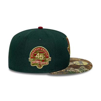 Houston Astros MLB Cooperstown Green New Era 59FIFTY Fitted Cap, side view showing a 45th Anniversary patch embroidered on the green crown, a woodland camo pattern visor with a gold 59FIFTY size sticker, and a red top button.