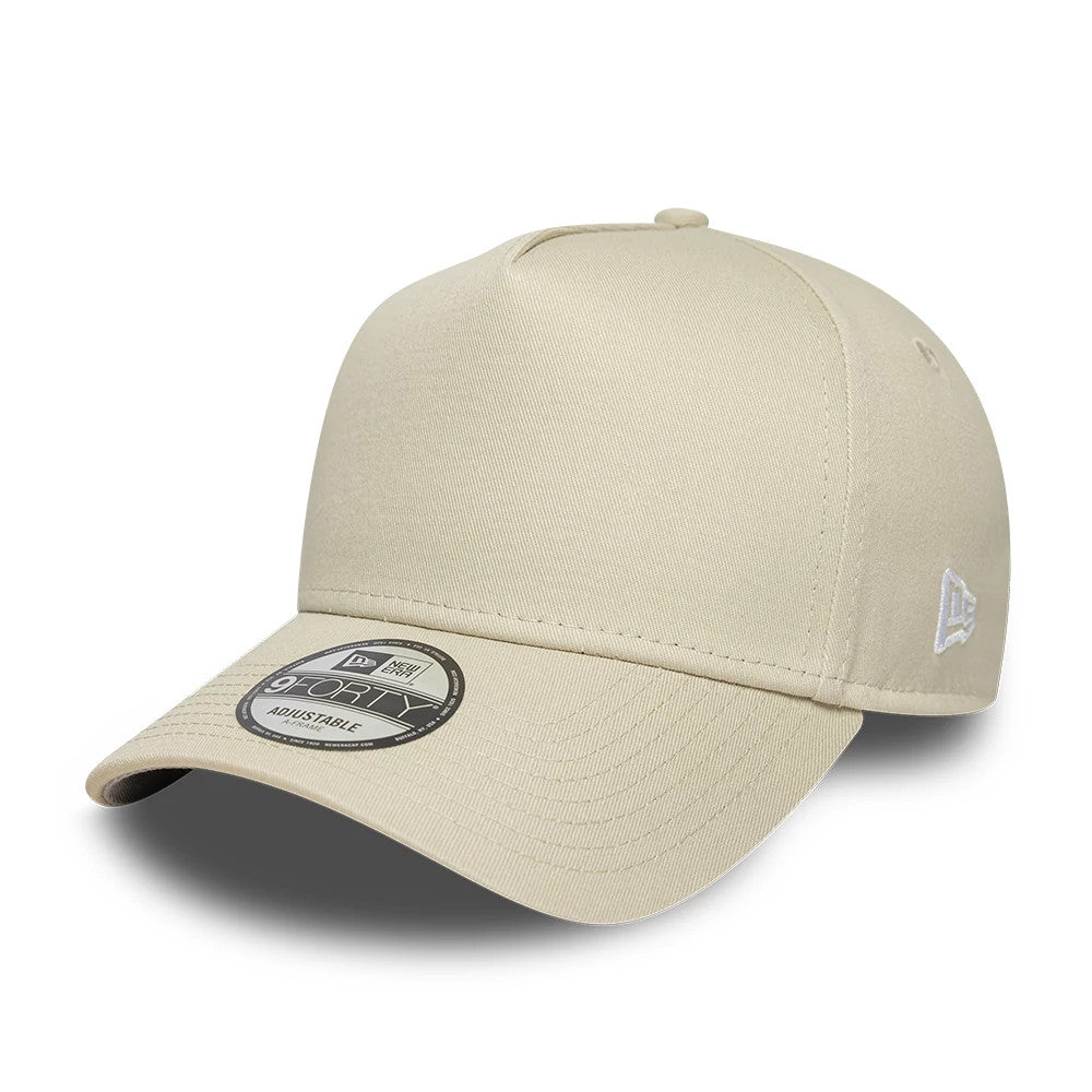 New Era Beige 9FORTY A-Frame Adjustable Cap, three-quarter view showing an embroidered New Era flag logo on the left side, a structured beige crown, and a curved visor with a 9FORTY size sticker on top.