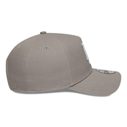 LA Dodgers Essential Pack Grey New Era 9FORTY A-Frame Adjustable Cap, side view showing the curved grey visor with a 9FORTY size sticker, small eyelets on the structured grey crown, and a barely embroidered LA logo.