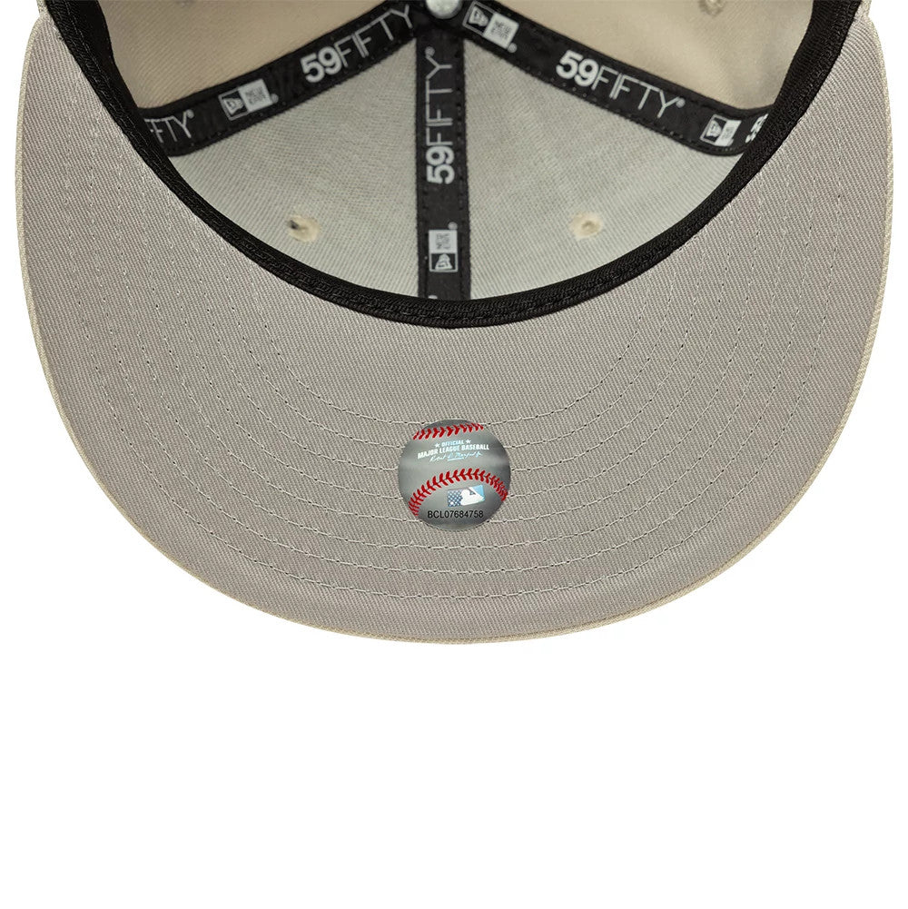 LA Dodgers MLB Beige New Era 59FIFTY Fitted Cap, inside view showing the contrasting black sweatband with branded 59FIFTY taping, beige undervisor with a Major League Baseball sticker in the centre, and matching beige stitching.