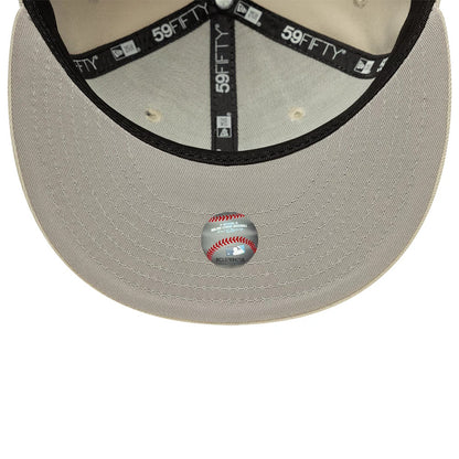 LA Dodgers MLB Beige New Era 59FIFTY Fitted Cap, inside view showing the contrasting black sweatband with branded 59FIFTY taping, beige undervisor with a Major League Baseball sticker in the centre, and matching beige stitching.