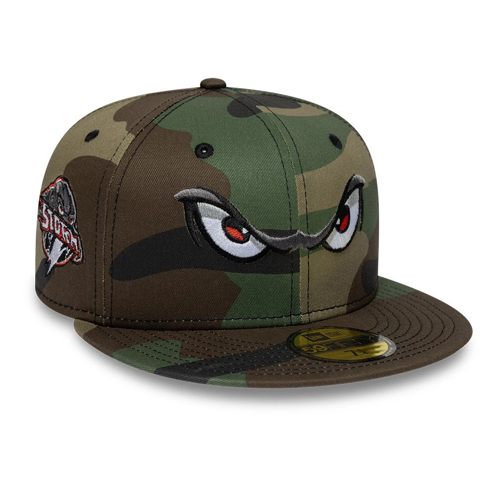 Lake Elsinore Storm MiLB Pinwheel Green New Era 59FIFTY Fitted Cap, three-quarter view showing raised embroidered eyes on the front panel, with a camouflage pattern, a Storm logo on the left side and a gold 59FIFTY size sticker on the visor.