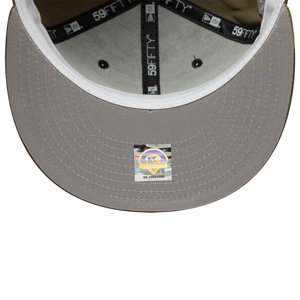 Lake Elsinore Storm MiLB Pinwheel Green New Era 59FIFTY Fitted Cap, inside view showcasing black 59FIFTY taping, a grey undervisor, and a holographic authenticity sticker in the centre displaying the MiLB logo and series number.