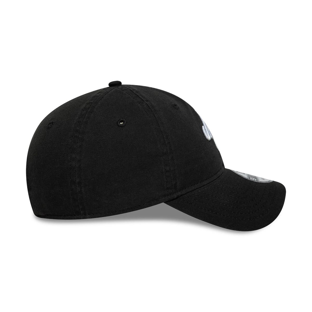 New Era Black 9TWENTY Adjustable Cap, side view showing the curved visor with silver 9TWENTY size sticker, embroidered eyelets on the unstructured black crown, and front logo stitching.