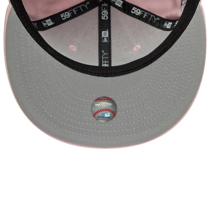 New York Yankees MLB World Series Pink New Era 59FIFTY Fitted Cap, inside view showing a grey undervisor with a baseball-themed sticker, black 59FIFTY taping with white text, and a light pink interior sweatband.