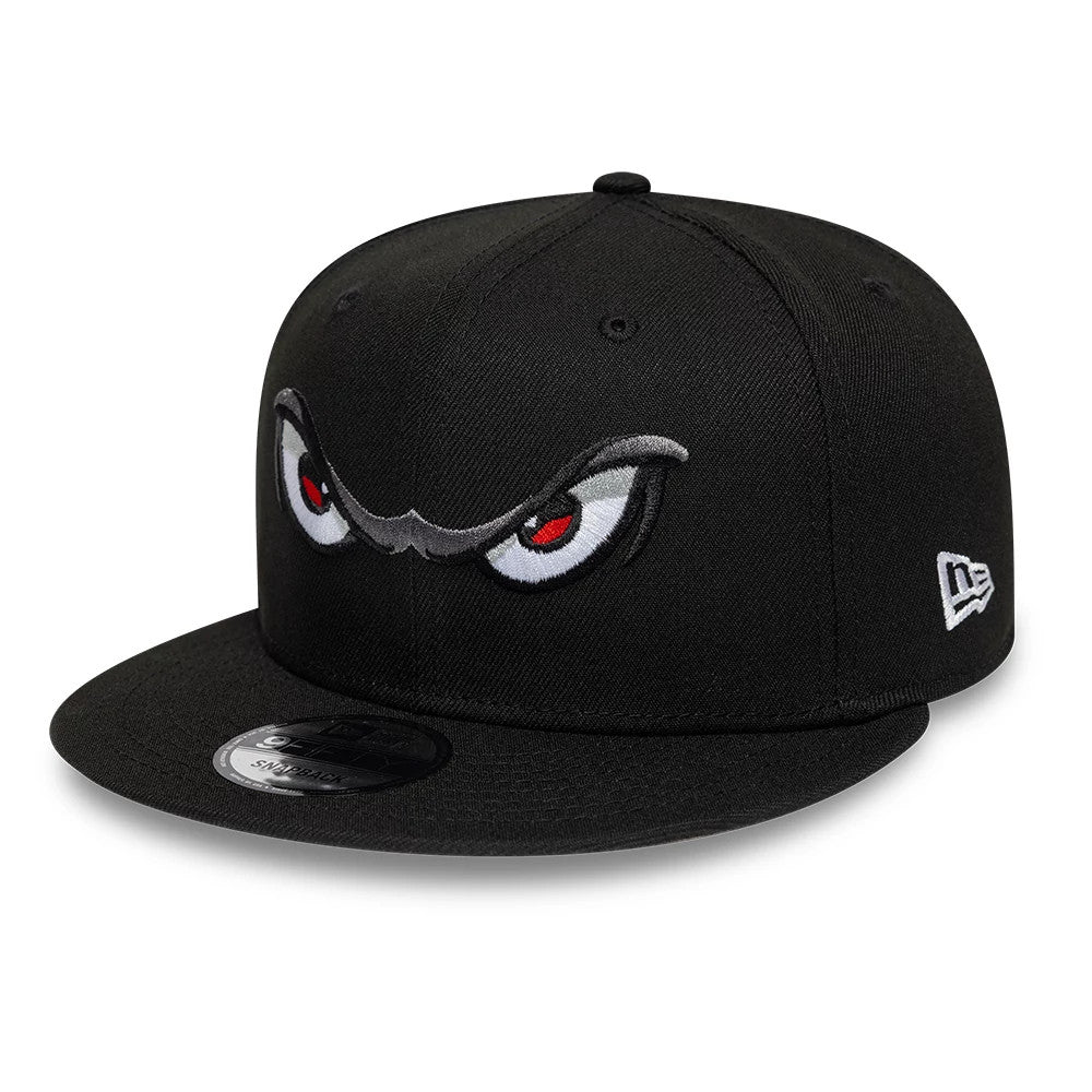 Lake Elsinore Storm MiLB Pinwheel Black New Era 9FIFTY Snapback Cap, front view showing the raised embroidery of intense eyes with red and white details on the front panels, a flat black visor with a 9FIFTY size sticker.