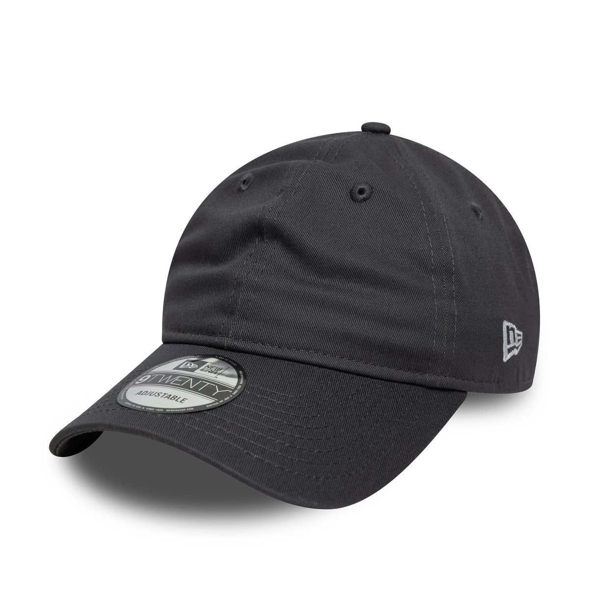New Era Dark Grey New Era 9TWENTY Adjustable Cap, three-quarter view showing the black curved visor with a 9TWENTY size sticker, grey New Era flag logo embroidered on the left side, and a soft, unstructured dark grey crown with eyelets.