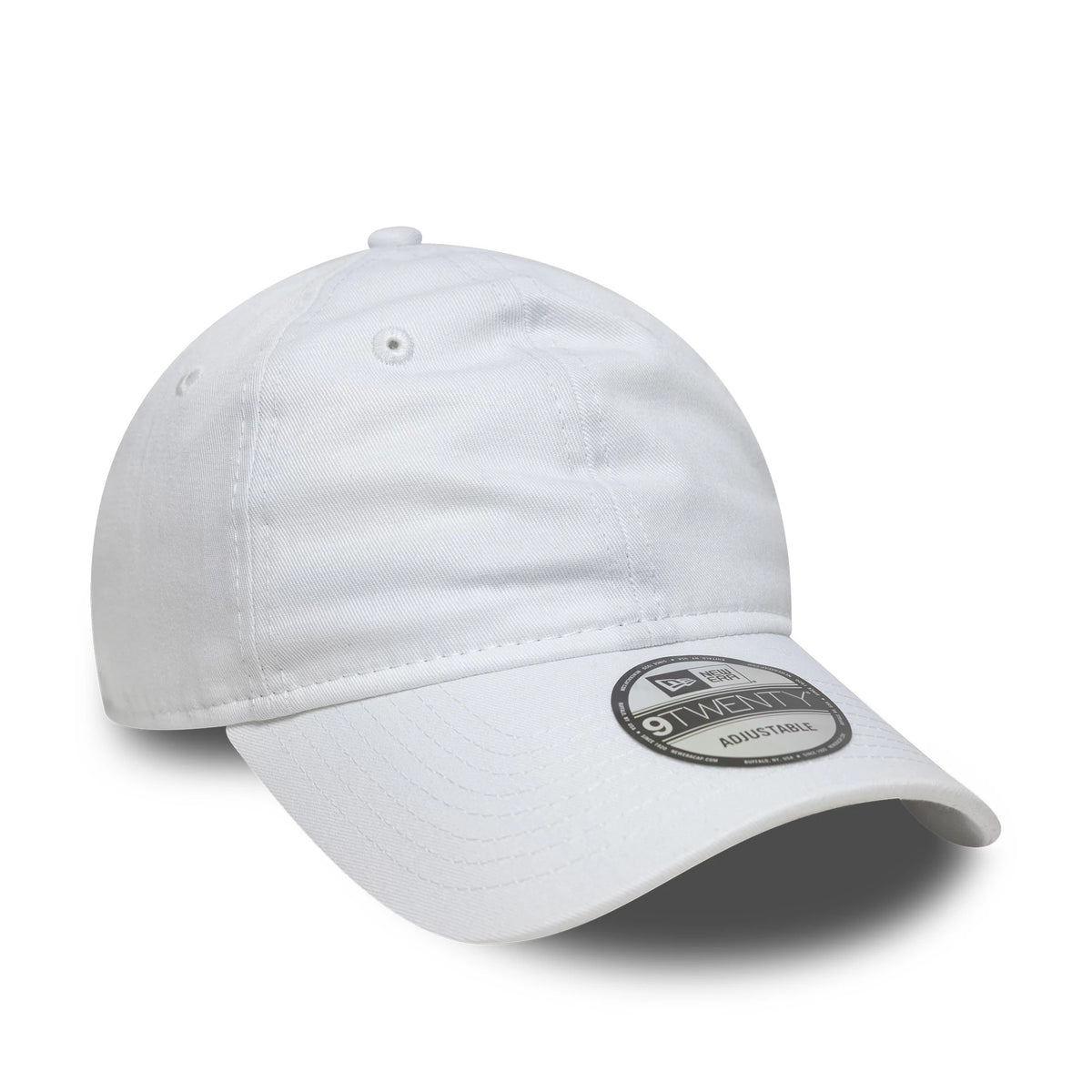 New Era White 9TWENTY Adjustable Cap, three-quarter view displaying a curved white visor with a 9TWENTY size sticker, embroidered eyelets, and a soft, unstructured crown for a casual, relaxed fit.