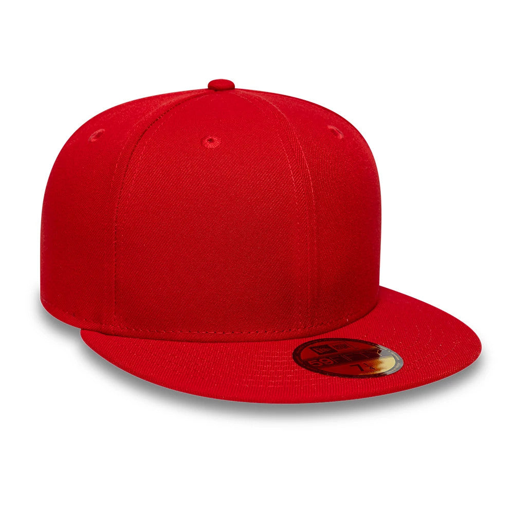 New Era Red 59FIFTY Fitted Cap, three-quarter view showing the structured red crown with embroidered eyelets, a flat red visor adorned with a gold 59FIFTY size sticker, and the matching red top button.