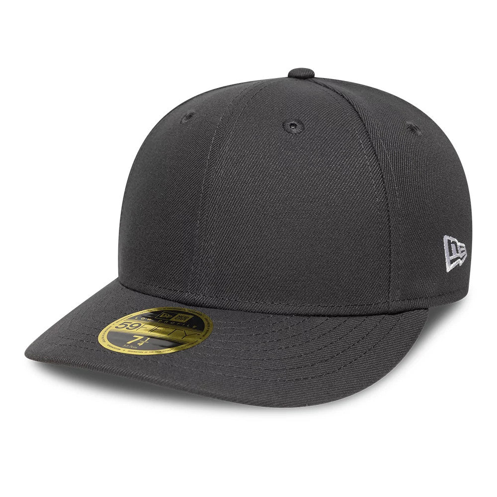 New Era Grey Low Profile 59FIFTY Fitted Cap, three-quarter view showing the black embroidered New Era flag logo on the left side, a structured grey crown, and a flat grey visor with a gold 59FIFTY size sticker on top.