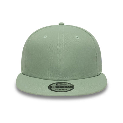New Era Green 9FIFTY Snapback Adjustable Cap, front view showing the plain structured green crown with matching green visor, featuring a black and silver 9FIFTY size sticker on the centre of the visor.