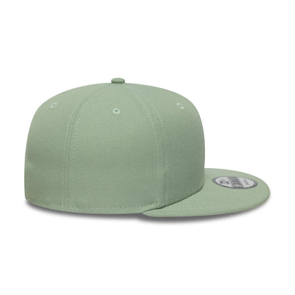 New Era Green 9FIFTY Snapback Adjustable Cap, side view showing the structured green crown with matching eyelets and top button, flat green visor, and 9FIFTY size sticker on the top of the visor.