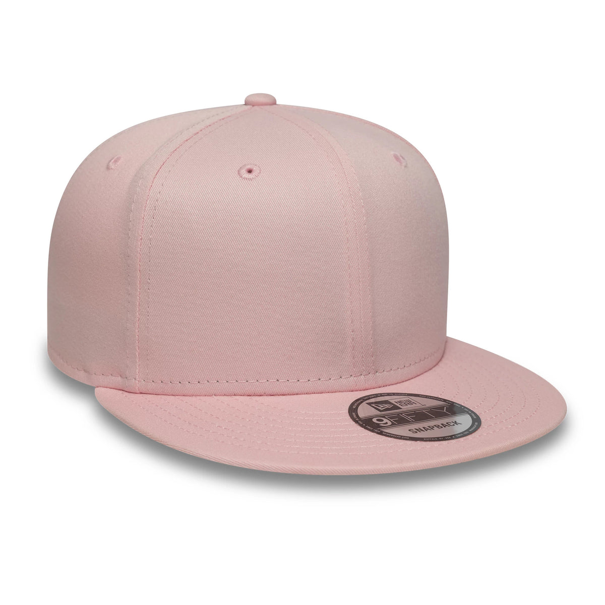 New Era Pink 9FIFTY Snapback Adjustable Cap, three-quarter view showing a pink crown with matching eyelets and top button, complemented by a flat pink visor with a 9FIFTY size sticker.