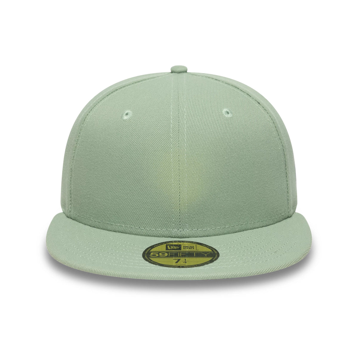 New Era Green 59FIFTY Fitted Cap, front view showing light green structured crown with matching flat visor and gold 59FIFTY size sticker, featuring embroidered eyelets and top button enhancing the cap’s clean and minimalistic look.