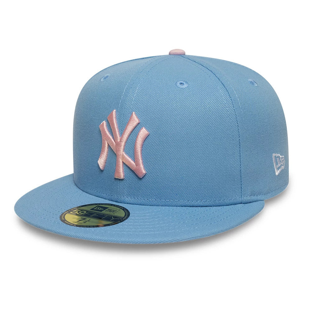 New York Yankees MLB Pastel Blue New Era 59FIFTY Fitted Cap, three-quarter view showing a pink embroidered NY logo on the front panels, a matching pastel blue flat visor with a gold 59FIFTY size sticker.