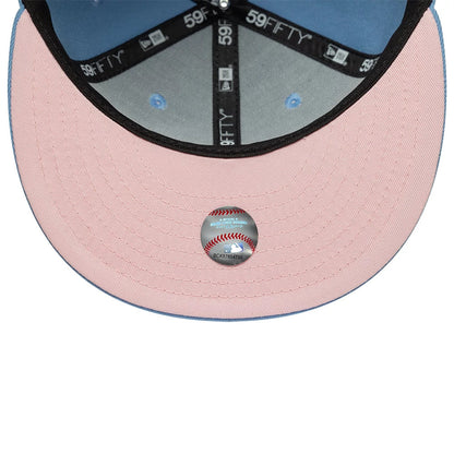New York Yankees MLB Pastel Blue New Era 59FIFTY Fitted Cap, inside view showing pink undervisor with an MLB size sticker, blue taping with repeating white 59FIFTY logos, and light blue interior panels with matching eyelets.