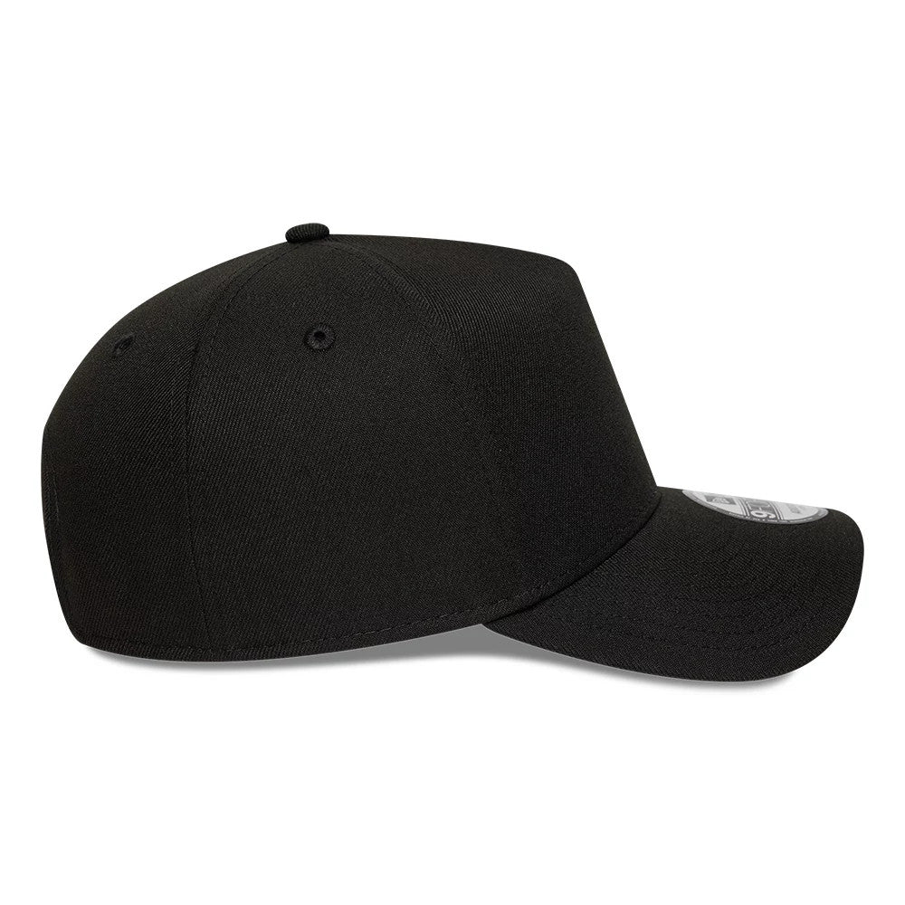 New Era Black 9FORTY A-Frame Adjustable Cap, side view showing the black crown with embroidered eyelets, curved black visor, and the grey 9FORTY size sticker on the top of the visor.