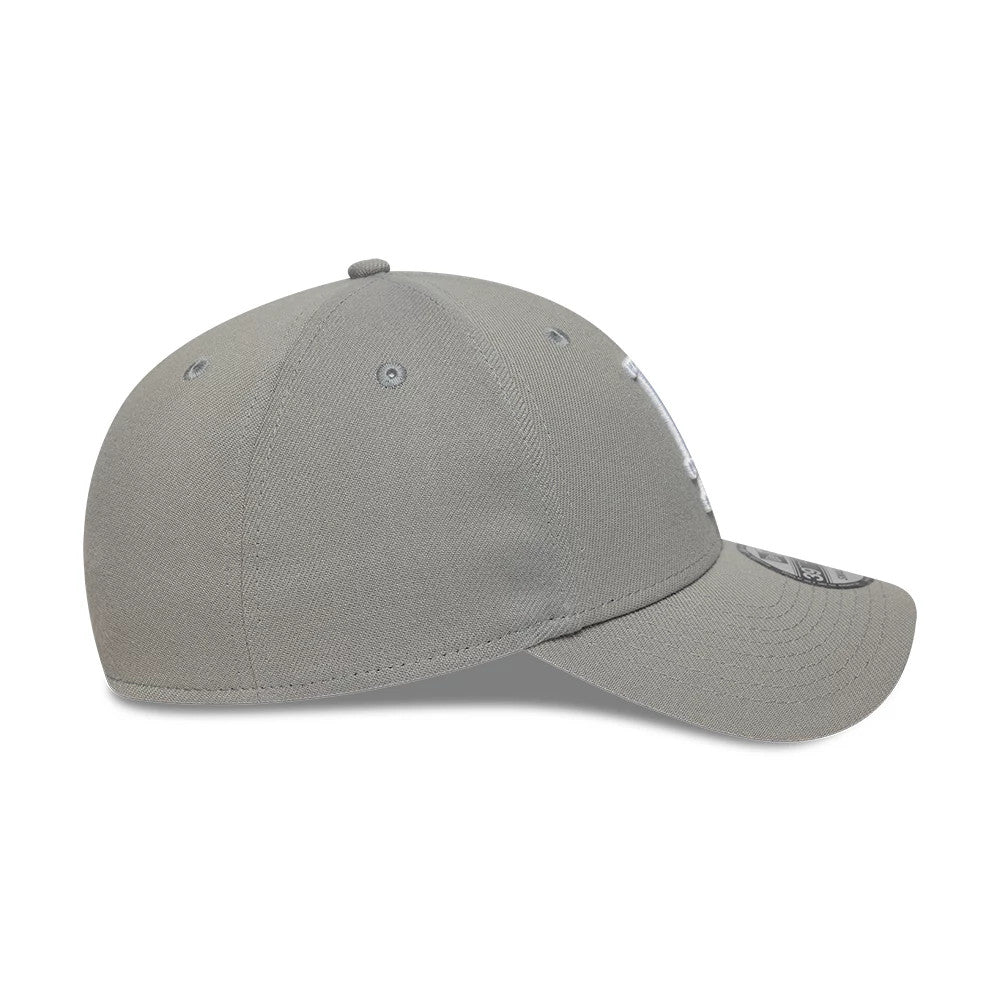 LA Dodgers MLB Grey New Era 39THIRTY Stretch Fit Cap, side view showing the embroidered white LA logo partially on the front panel, a curved grey visor with a 39THIRTY size sticker, and matching grey eyelets on a rounded crown.