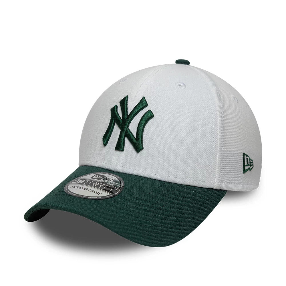 New York Yankees MLB White New Era 39THIRTY Stretch Fit Cap, three-quarter view showing a green raised embroidered NY logo on the front white panel, contrasted by a curved green visor with a 39THIRTY size sticker.