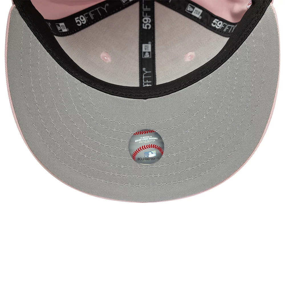 LA Dodgers MLB Pink New Era 59FIFTY Fitted Cap, inside view showing black 59FIFTY taping, a grey undervisor with a baseball sticker in the centre, and light pink interior panels with matching eyelets.