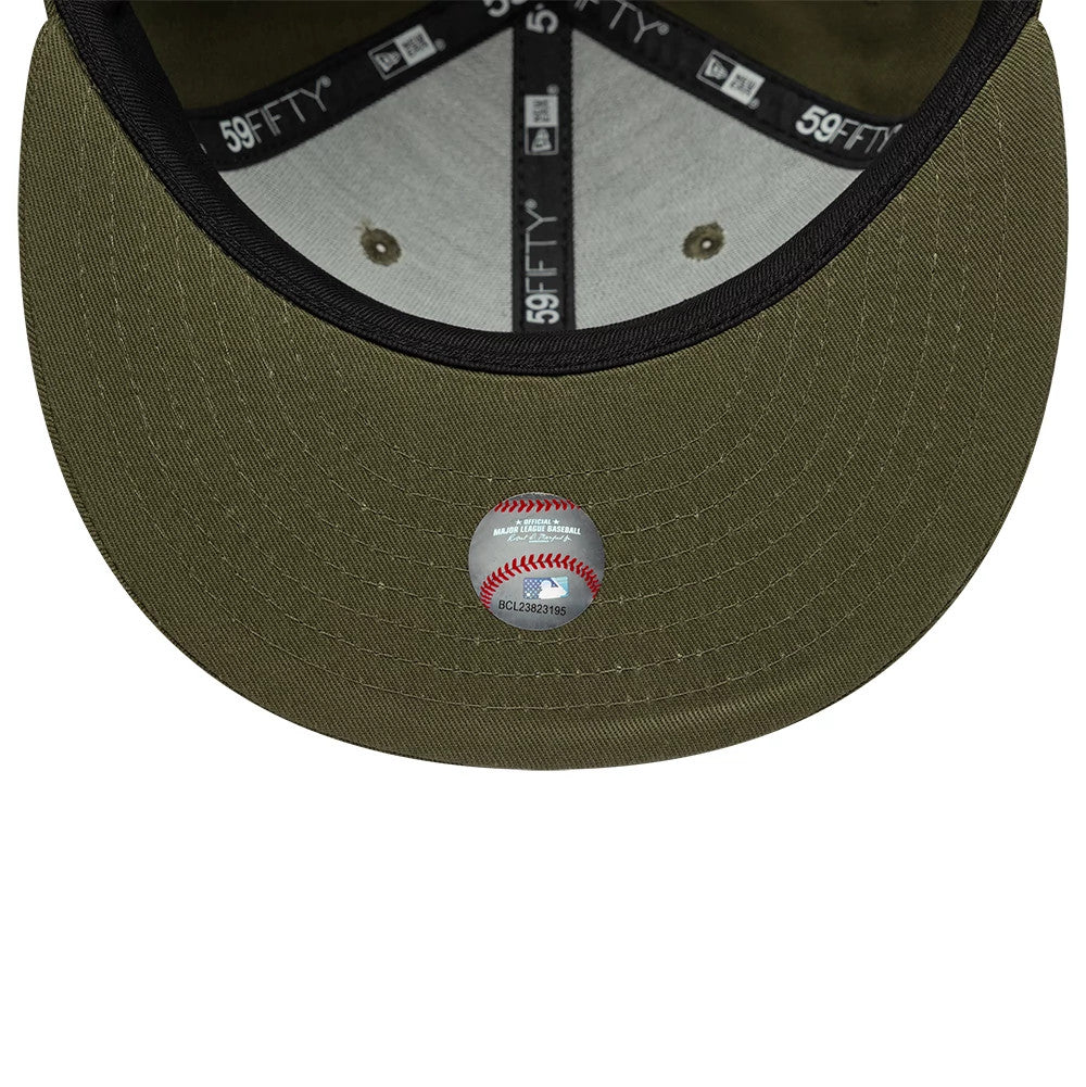 Chicago White Sox MLB Green New Era 59FIFTY Fitted Cap, inside view showing the grey undervisor with a baseball sticker, black taping with 59FIFTY branding, and two eyelets on the structured green crown.