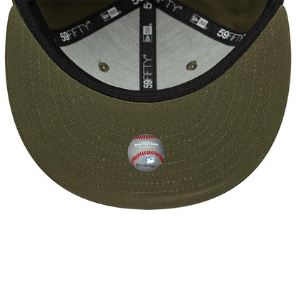 Chicago White Sox MLB Green New Era 59FIFTY Fitted Cap, inside view showing the grey undervisor with a baseball sticker, black taping with 59FIFTY branding, and two eyelets on the structured green crown.