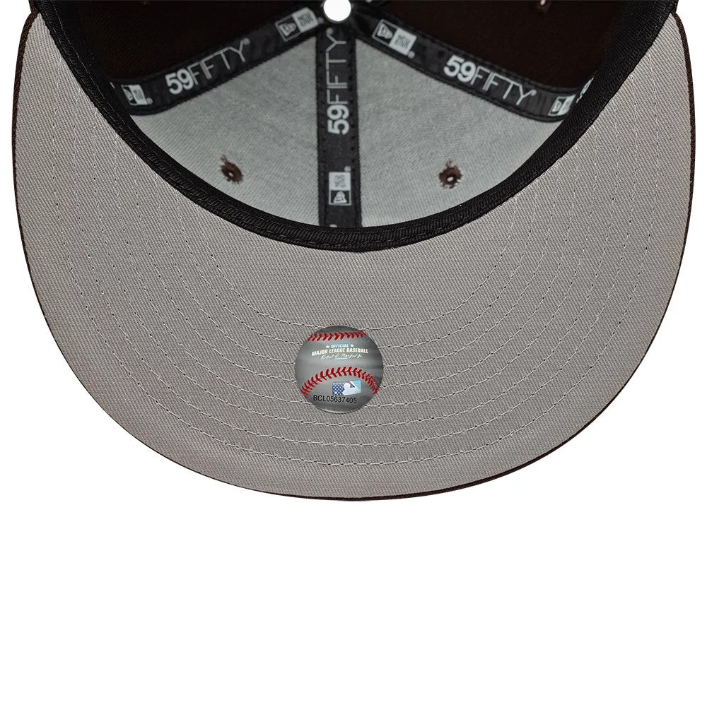 Athletics MLB Dark Brown New Era 59FIFTY Fitted Cap, inside view showing black 59FIFTY taping along the seams, a dark brown sweatband, and a grey undervisor with a baseball graphic sticker at the centre, through the cap.