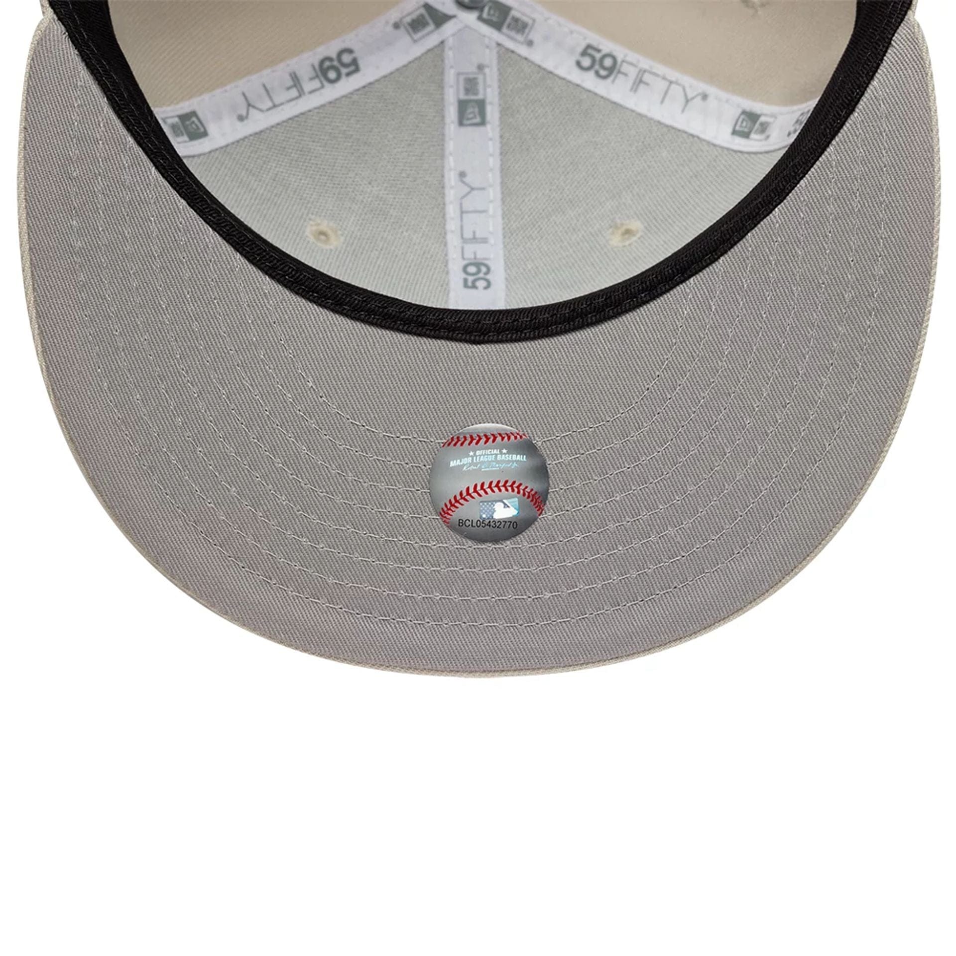 Pictured is this MLB Athletics 59FIFTY Fitted cap in beige. 2