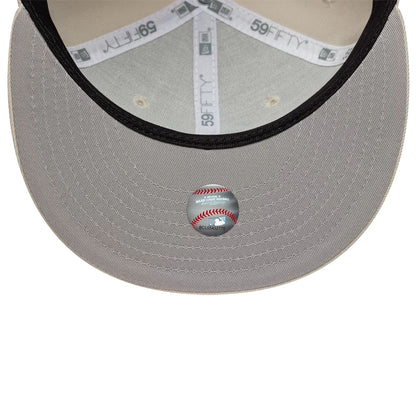 Pictured is this MLB Athletics 59FIFTY Fitted cap in beige. 2