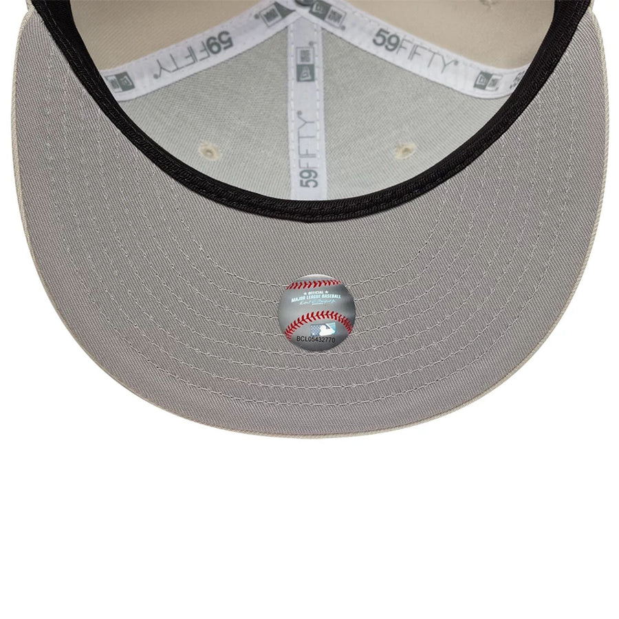 Pictured is this MLB Athletics 59FIFTY Fitted cap in beige. 2