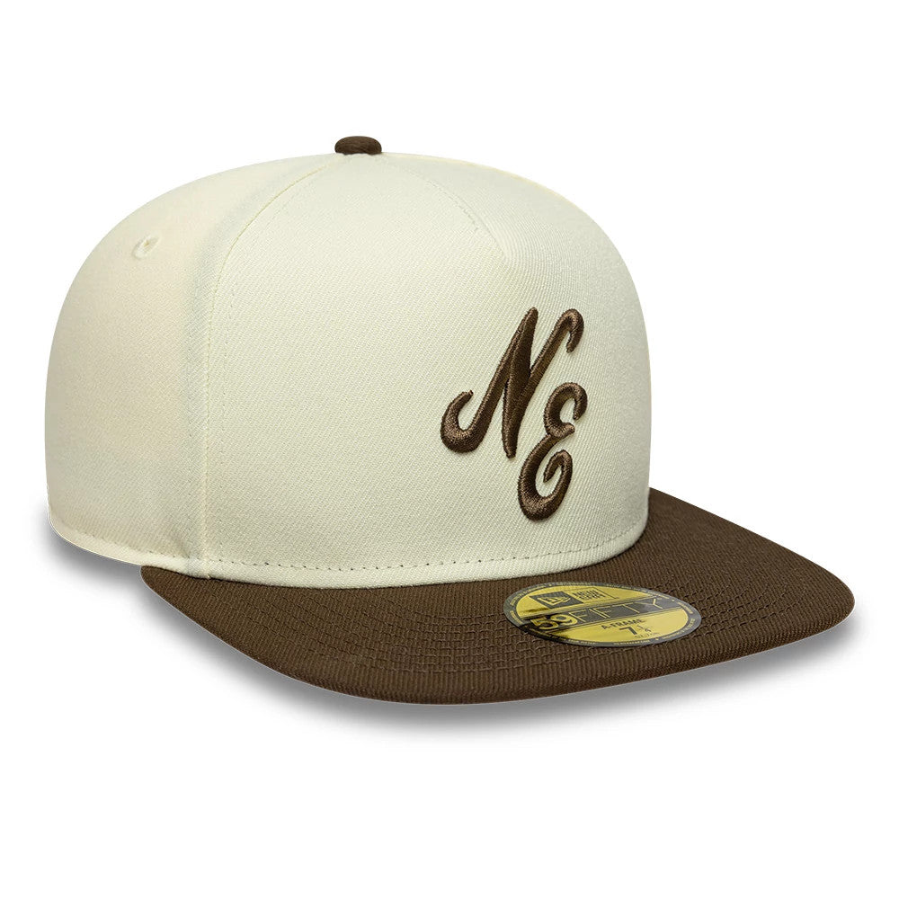 New Era Cream 59FIFTY A-Frame Fitted Cap, three-quarter view showing the brown embroidered NE logo on the cream front panel, matching brown flat visor with a gold 59FIFTY size sticker, and brown top button.