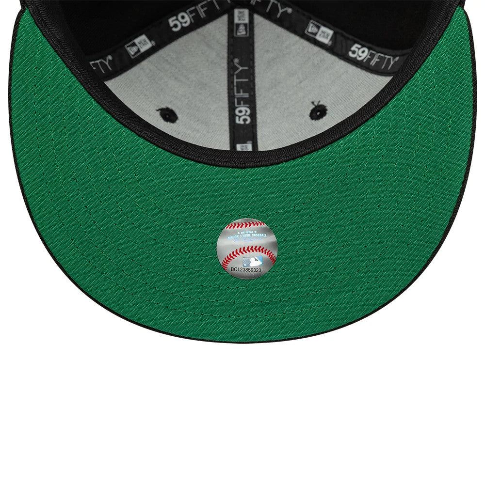 New York Mets MLB Black New Era 59FIFTY Fitted Cap, inside view showing grey taping with 59FIFTY branding, a black sweatband, and a bright green undervisor with an official baseball sticker at the centre near the edge.