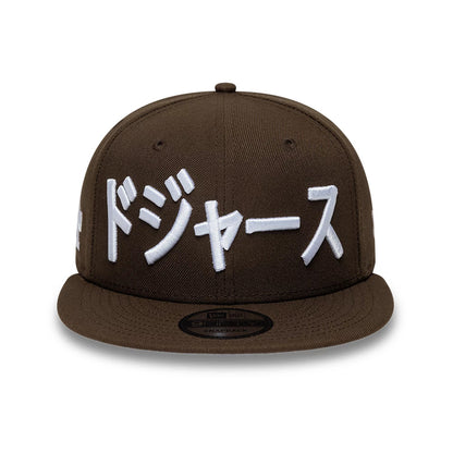 Pictured is this MLB Kanji LA Dodgers 9FIFTY Snapback Adjustable cap in dark brown. 3