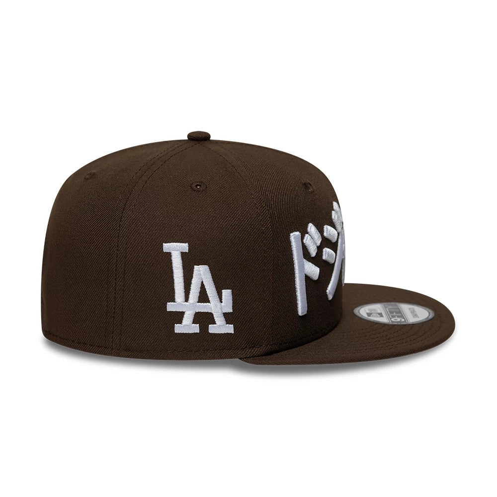 Pictured is this MLB Kanji LA Dodgers 9FIFTY Snapback Adjustable cap in dark brown. 5