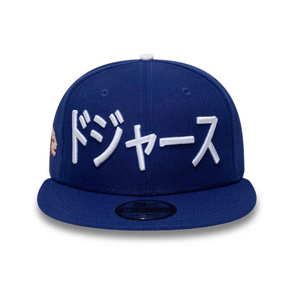 Pictured is this MLB Kanji LA Dodgers 9FIFTY Snapback Adjustable cap in dark blue. 3