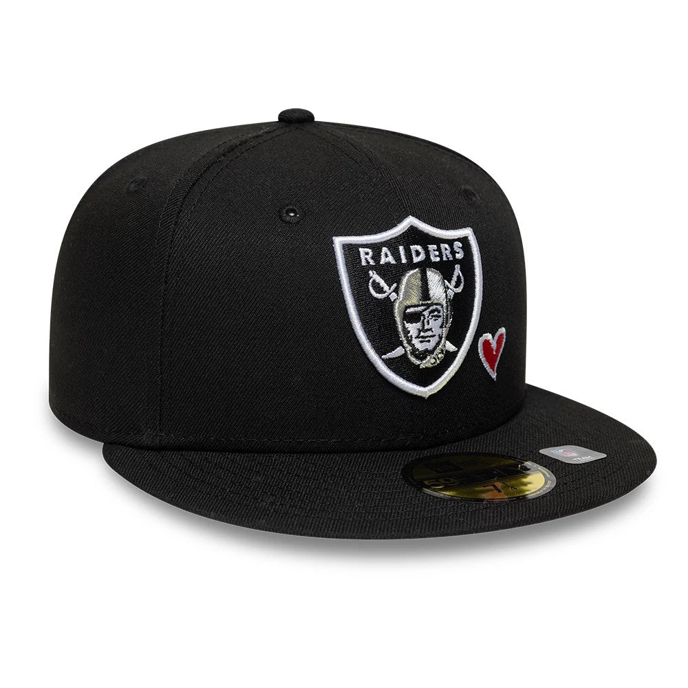 Las Vegas Raiders NFL Heart Black New Era 59FIFTY Fitted Cap, front view showing the raised embroidered Raiders logo in black and white on the front panel, a small red heart embroidery to the side, and a gold 59FIFTY size sticker on the black visor.