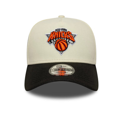 Pictured is this NBA New York Knicks 9FORTY A-Frame cap in white and black. 3