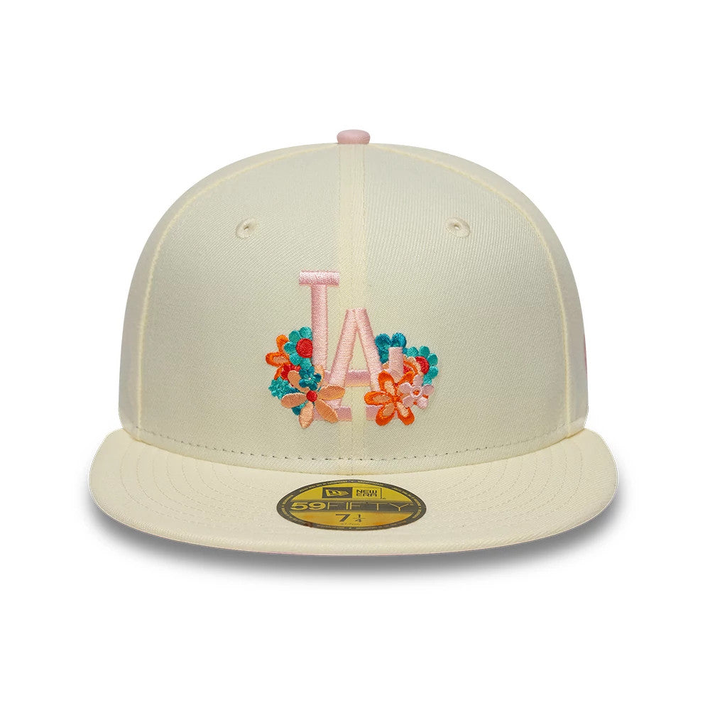 LA Dodgers MLB Floral Cream New Era 59FIFTY Fitted Cap, front view showing a pink embroidered LA logo surrounded by floral designs in blue, orange, and pink on the cream front panels, with a gold 59FIFTY size sticker on the flat cream visor.