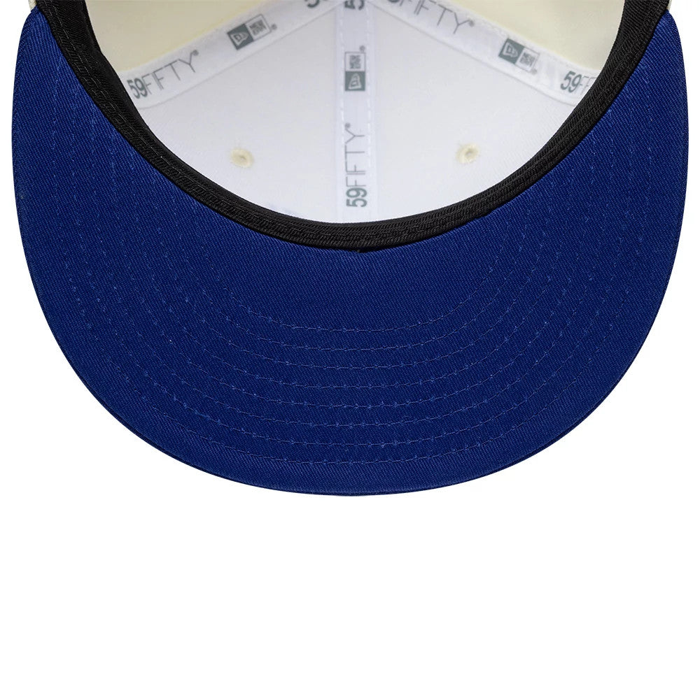 Alpine Racing Cream & Blue New Era 59FIFTY Fitted Cap, inside view showing white taping with grey 59FIFTY branding, a black sweatband encircling the structured cream crown, and a contrasting blue undervisor.