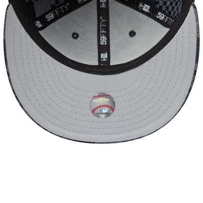 New York Yankees MLB Denim Blue New Era 59FIFTY Fitted Cap, inside view showing a grey undervisor with a Major League Baseball sticker centred, dark taping with 59FIFTY branding, and a light grey sweatband beneath the structured crown.