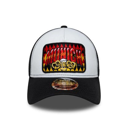 Pictured is this New Era Munich 9FORTY M-Crown A-Frame Trucker cap in white & black. 2