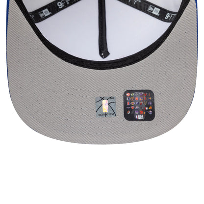 Pictured is this NBA Champs 2025 - 2026 New York Knicks 9FIFTY A-Frame Snapback cap in white and blue. 2