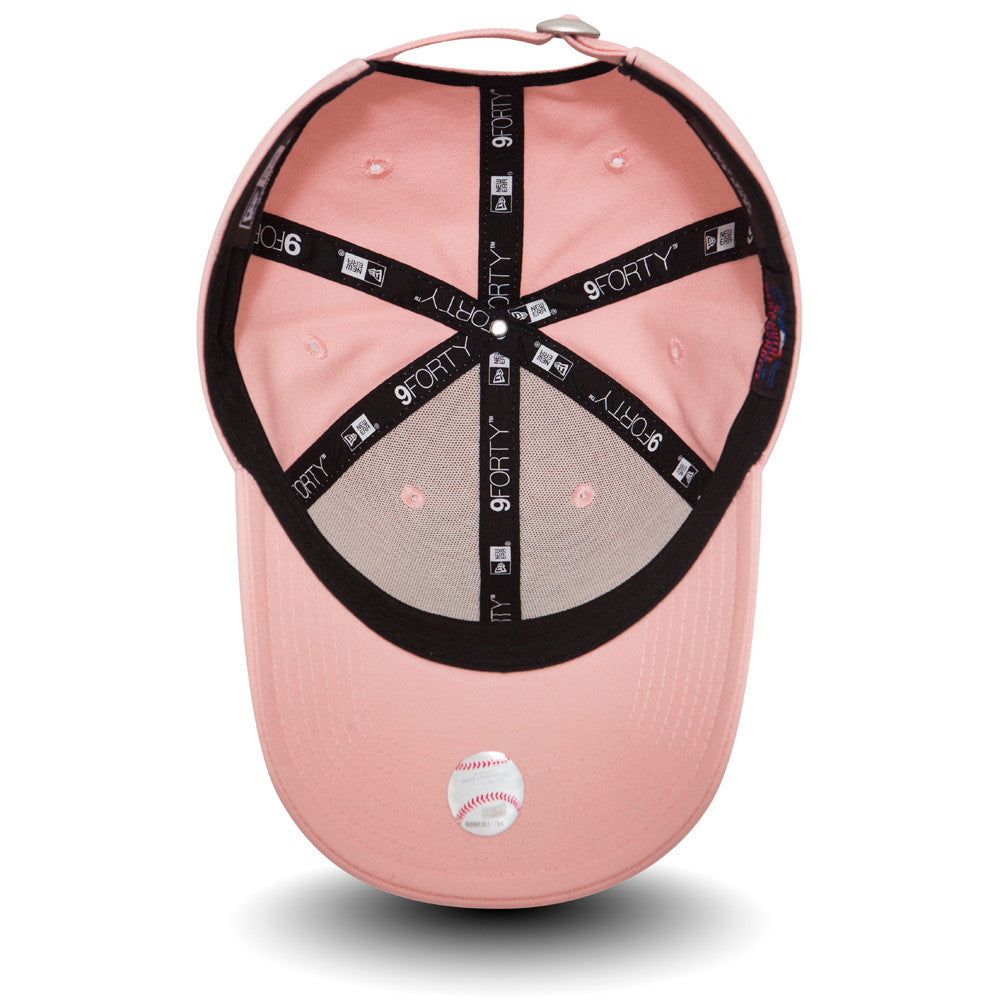 New York Yankees Essential Womens Pink New Era 9FORTY Cap, inside view showing the grey undervisor with a baseball graphic sticker, black taping with repeated 9FORTY logos, and a soft pink sweatband contrasting against the cap's pink interior.