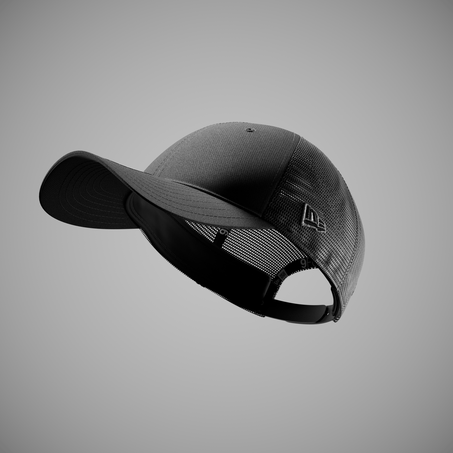 Black new era trucker cap on a grey background