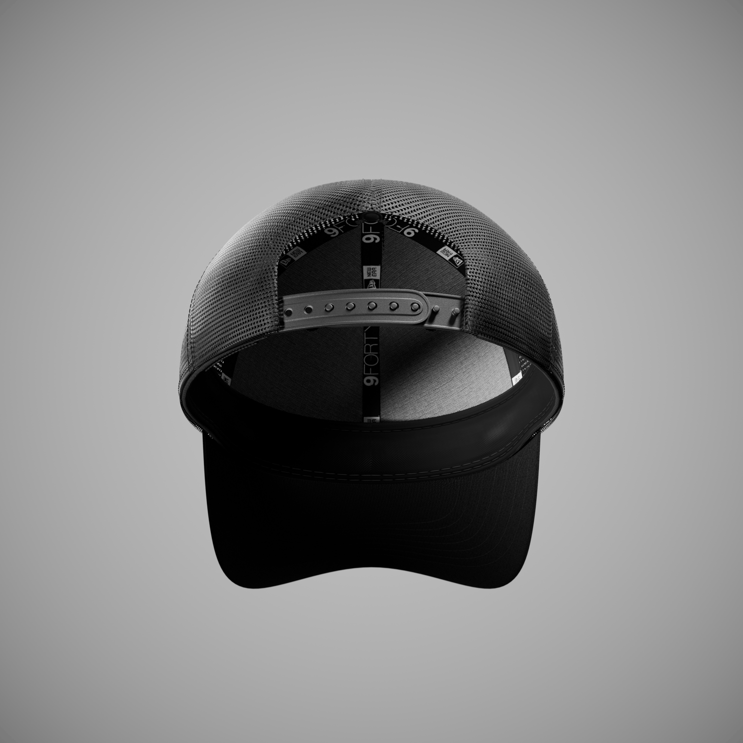 Black new era trucker cap on a grey background