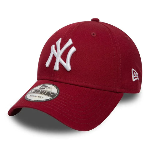 Slide 2:Red 9FORTY baseball cap with white logo on a white background