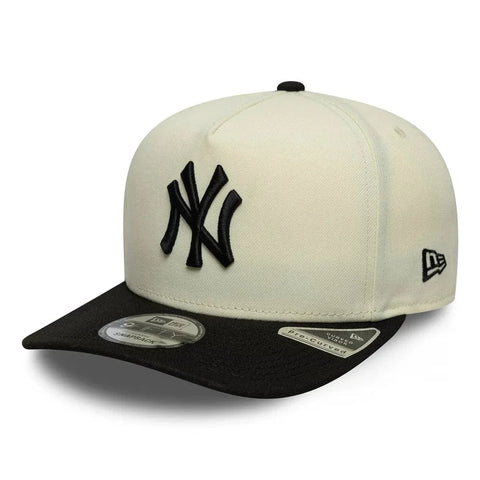 Slide 6:Baseball aframe cap with black and white design on a white background