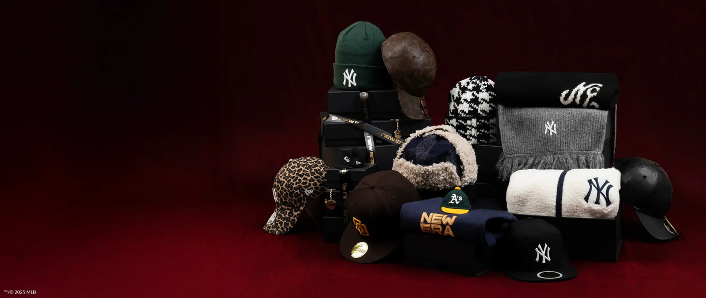 Collection of various caps including New Era and Yankees logos on a dark background